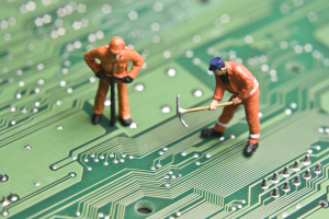 Repair men fixing circuit board